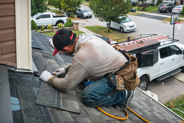 Professional Roofing technician working in Alpine, NY